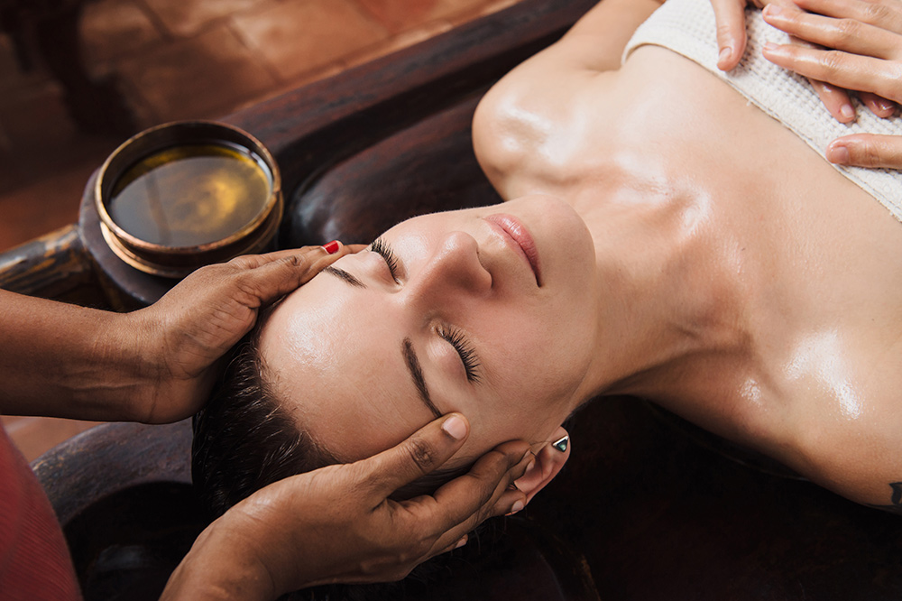 lady on massage table with eyes closed