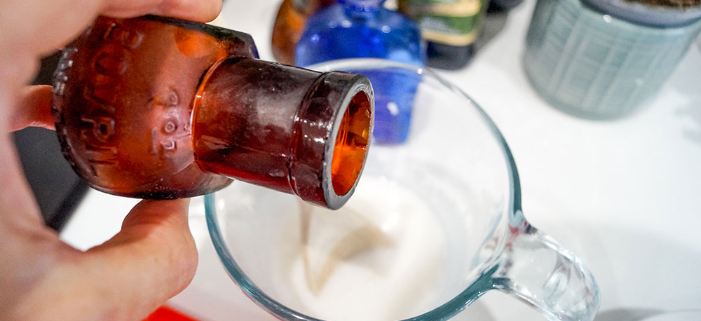 adding essential oil blend to melted soap